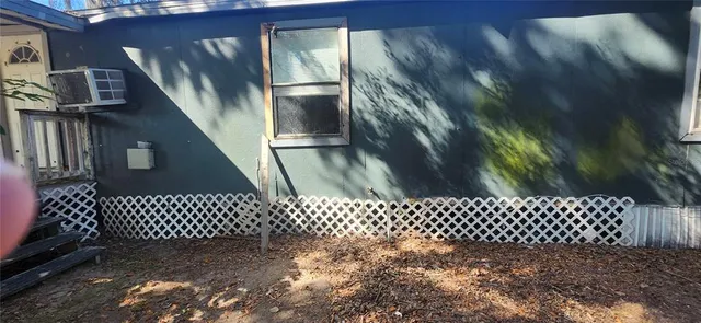 front view of a house with a tree