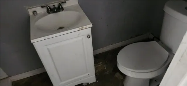 a bathroom with a sink and toilet