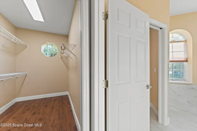 a view of an entryway with wooden floor