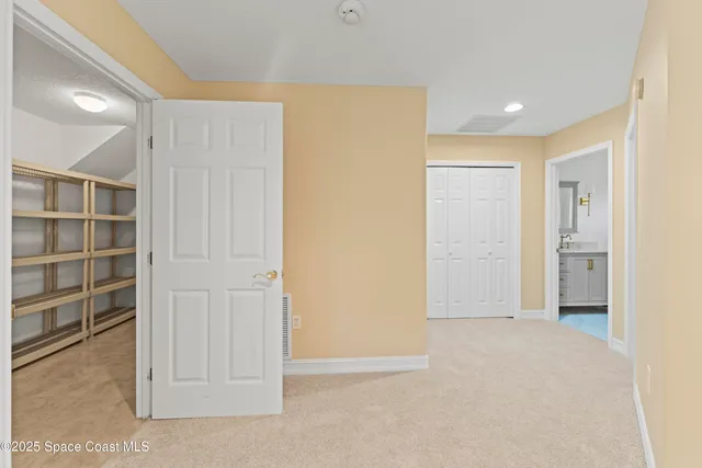 a bathroom with a toilet a sink a tub and mirror