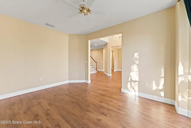 a view of a kitchen with white cabinets