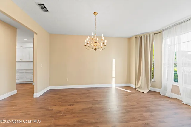 a kitchen with cabinets a sink and appliances