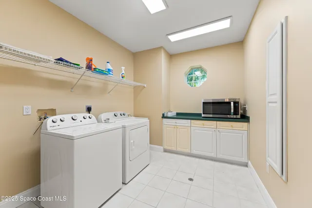 a view of kitchen with kitchen island white cabinets and wooden floor