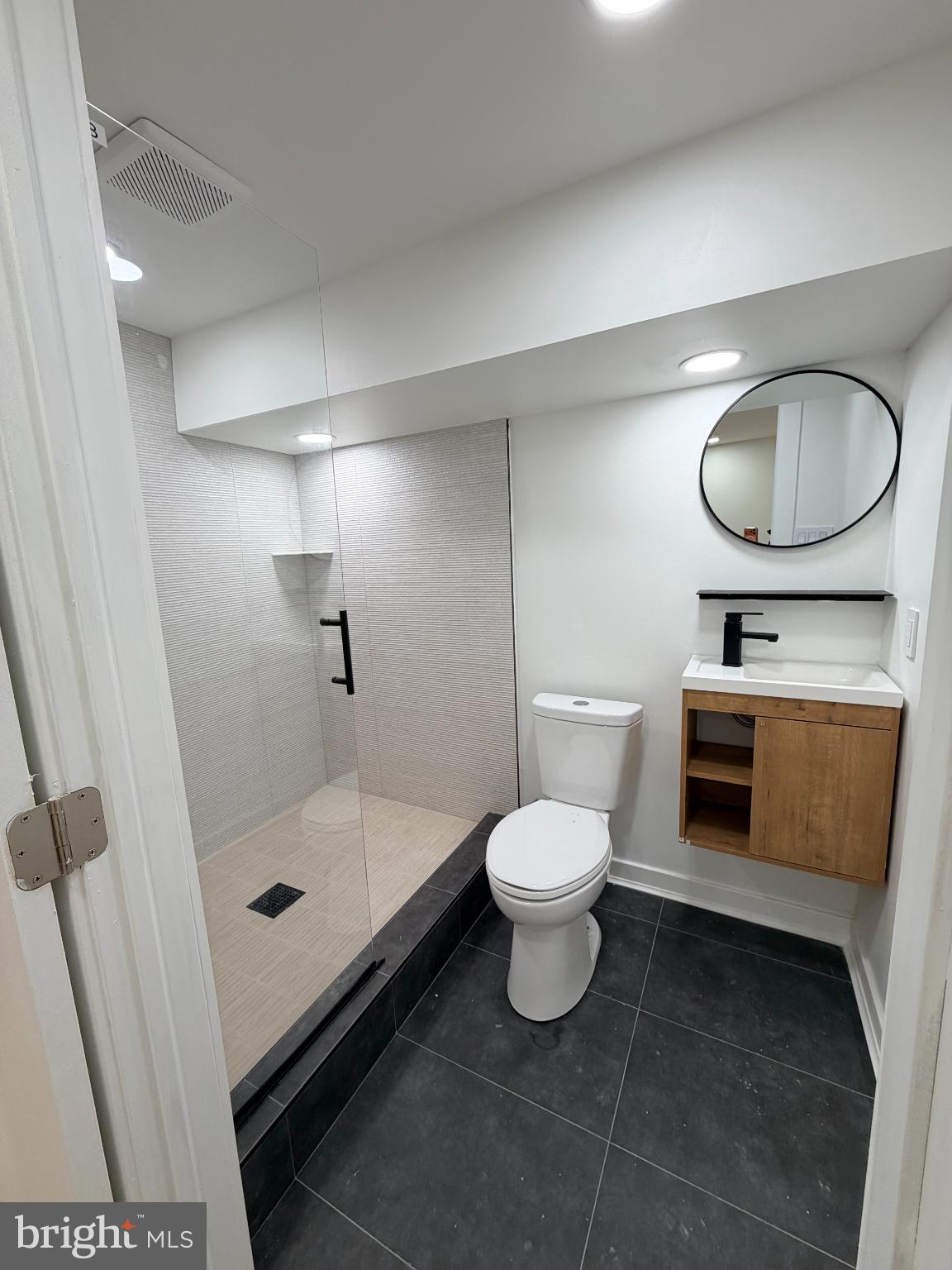 5436 Ridgewood Street Philadelphia, PA 19143 - Photo 11 of 30 a bathroom with a toilet and a shower