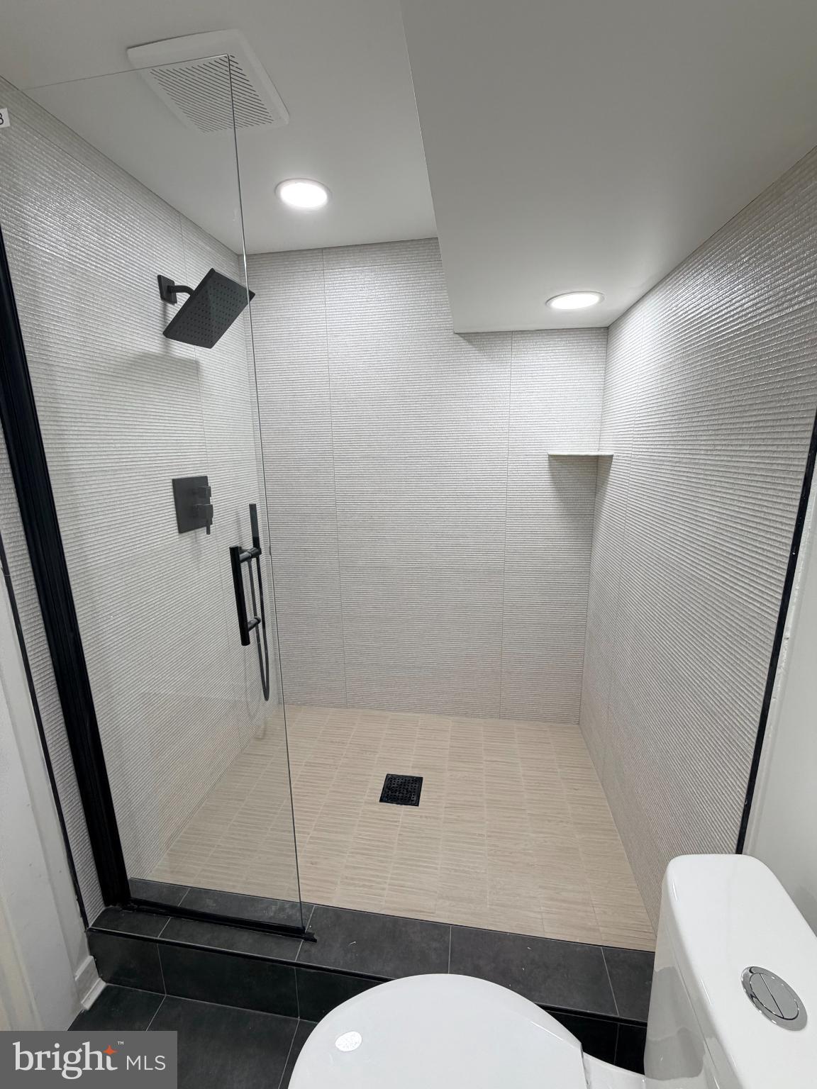 5436 Ridgewood Street Philadelphia, PA 19143 - Photo 12 of 30 a bathroom with a sink a toilet a shower and a mirror