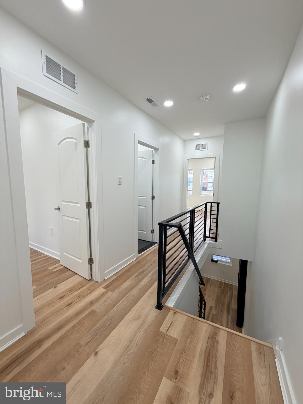 5436 Ridgewood Street Philadelphia, PA 19143 - Photo 23 of 30 a view of a hallway with wooden floor and staircase