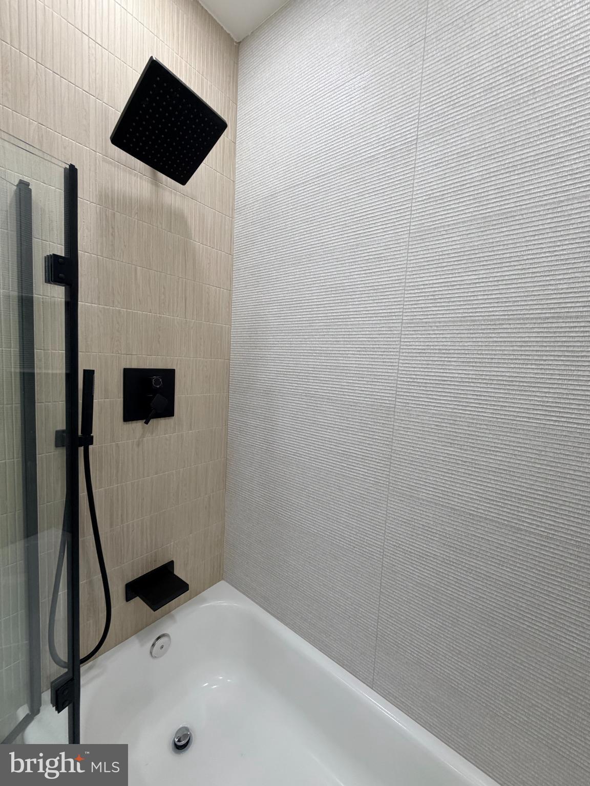 5436 Ridgewood Street Philadelphia, PA 19143 - Photo 26 of 30 a bathroom with a shower and a sink