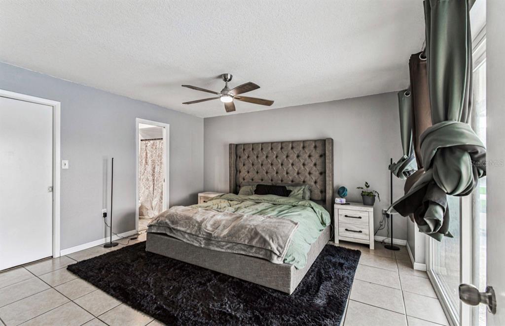 7112 Vista Way New Port Richey, FL 34653 - Photo 39 of 54 a bedroom with a bed and a window