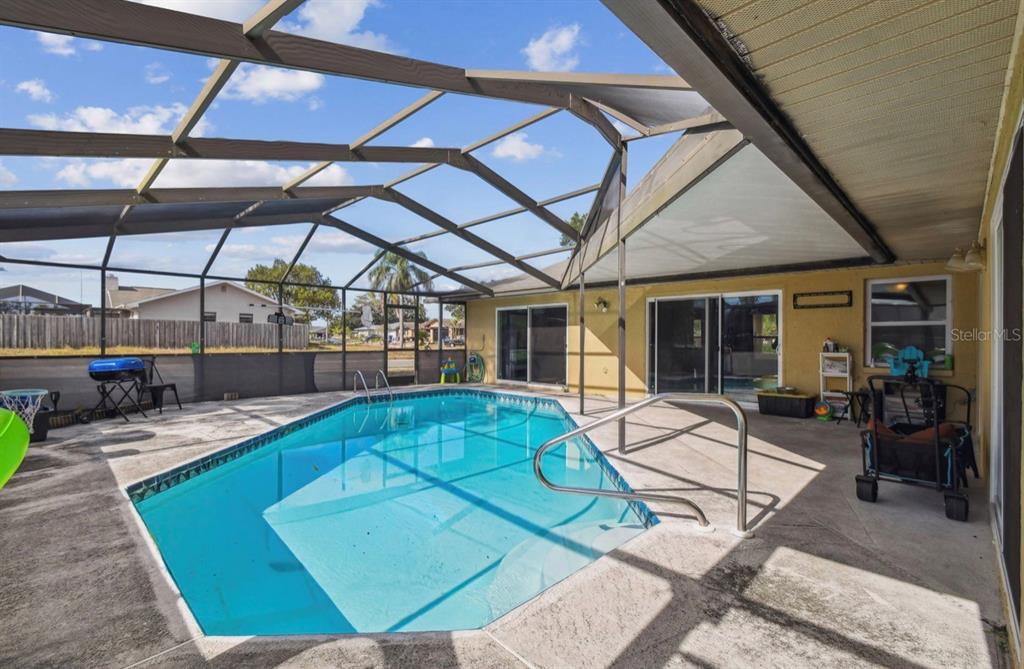 7112 Vista Way New Port Richey, FL 34653 - Photo 45 of 54 a view of a swimming pool with a patio