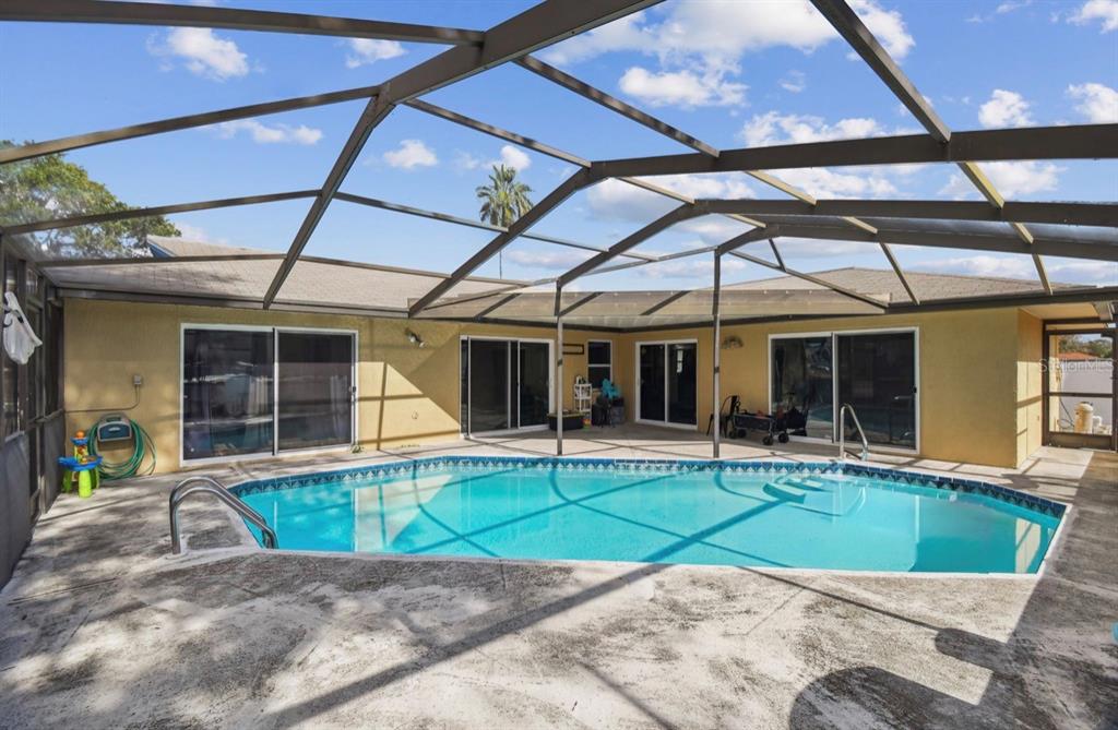 7112 Vista Way New Port Richey, FL 34653 - Photo 46 of 54 a view of a house with a yard and sitting area