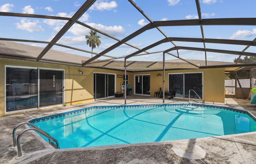7112 Vista Way New Port Richey, FL 34653 - Photo 47 of 54 a view of pool with a backyard