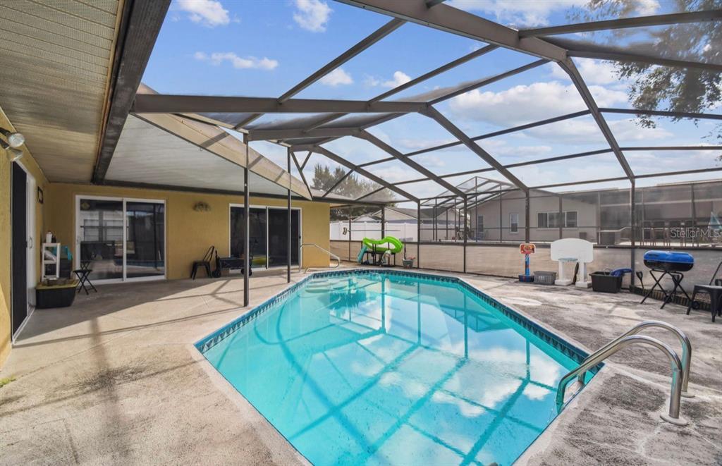 7112 Vista Way New Port Richey, FL 34653 - Photo 48 of 54 a view of a swimming pool with a patio