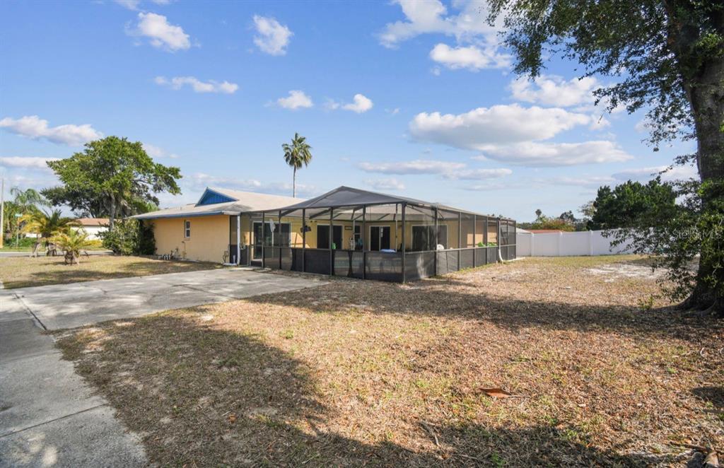 7112 Vista Way New Port Richey, FL 34653 - Photo 50 of 54 a front view of a house with a yard