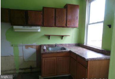 3601 Old York Road Baltimore, MD 21218 - Photo 8 of 11 a kitchen with a sink and cabinets