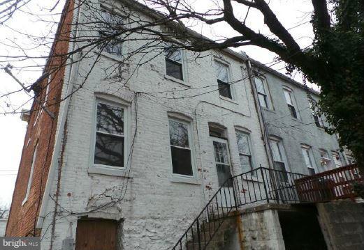 3601 Old York Road Baltimore, MD 21218 - Photo 10 of 11 a view of a house with a large tree