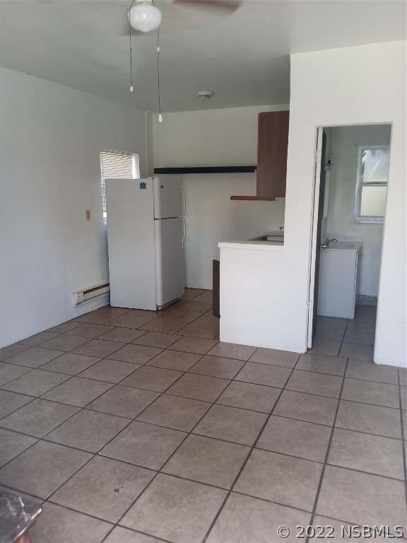 703 South Ridgewood Avenue, Unit 4 Edgewater, FL 32132 - Photo 2 of 4 a view of a storage & utility room with a sink