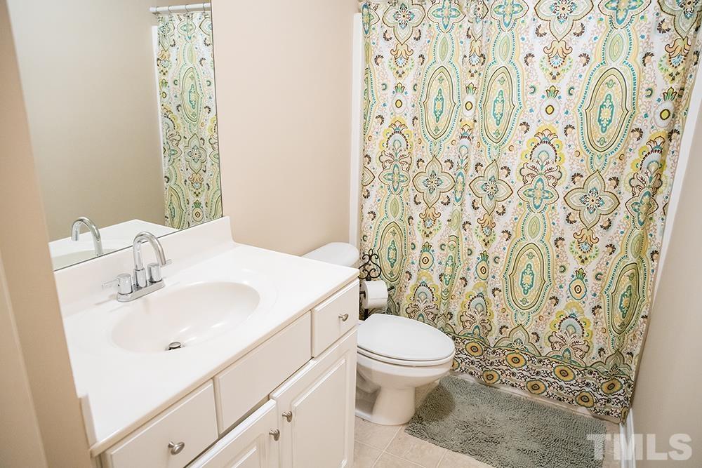 307 Oaks Lane Road Timberlake, NC 27583 - Photo 26 of 43 a bathroom with a sink toilet and shower