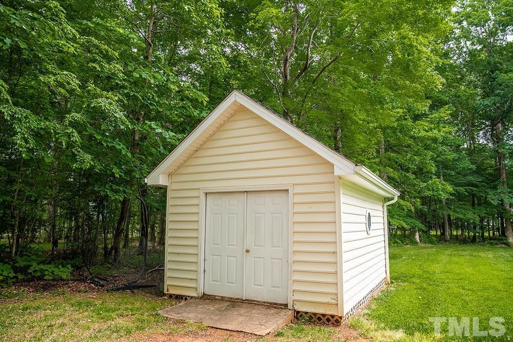 307 Oaks Lane Road Timberlake, NC 27583 - Photo 29 of 43 a view of a house with a yard