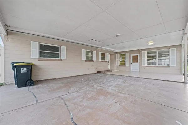 a view of an empty room with windows