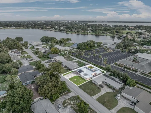 an aerial view of residential houses with city view