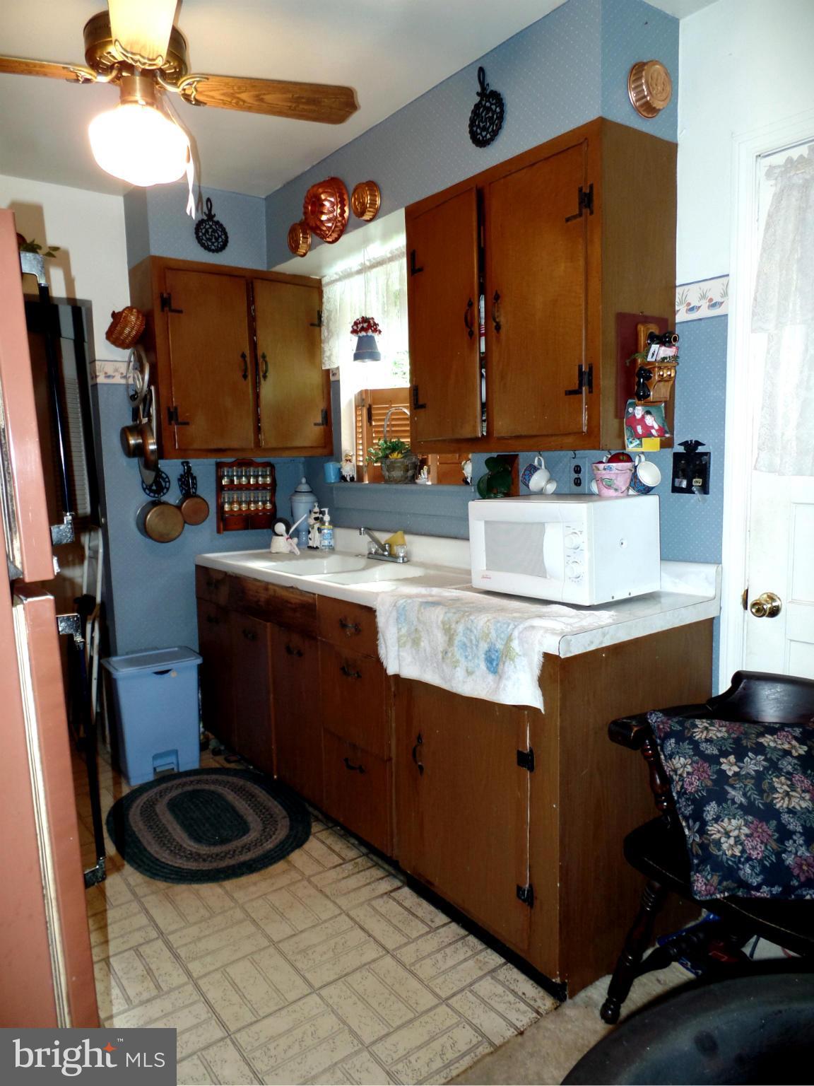 2938 Ridge Road Baltimore, MD 21244 - Photo 8 of 16 a bathroom with a sink and a mirror