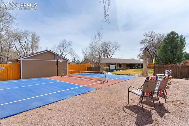 a view of swimming pool with lounge chair