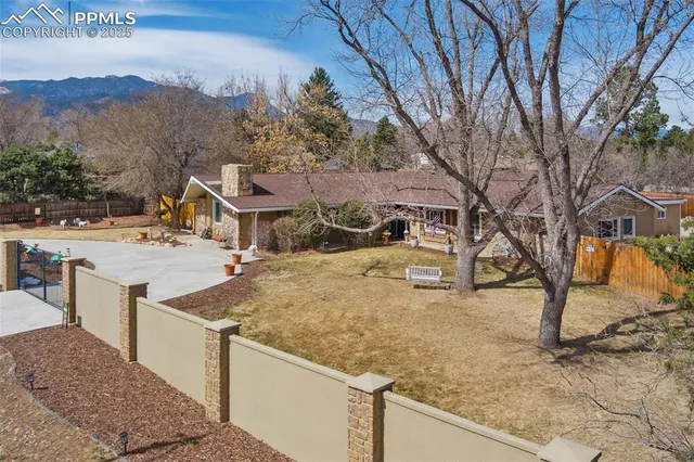 a view of a house with snow on the road