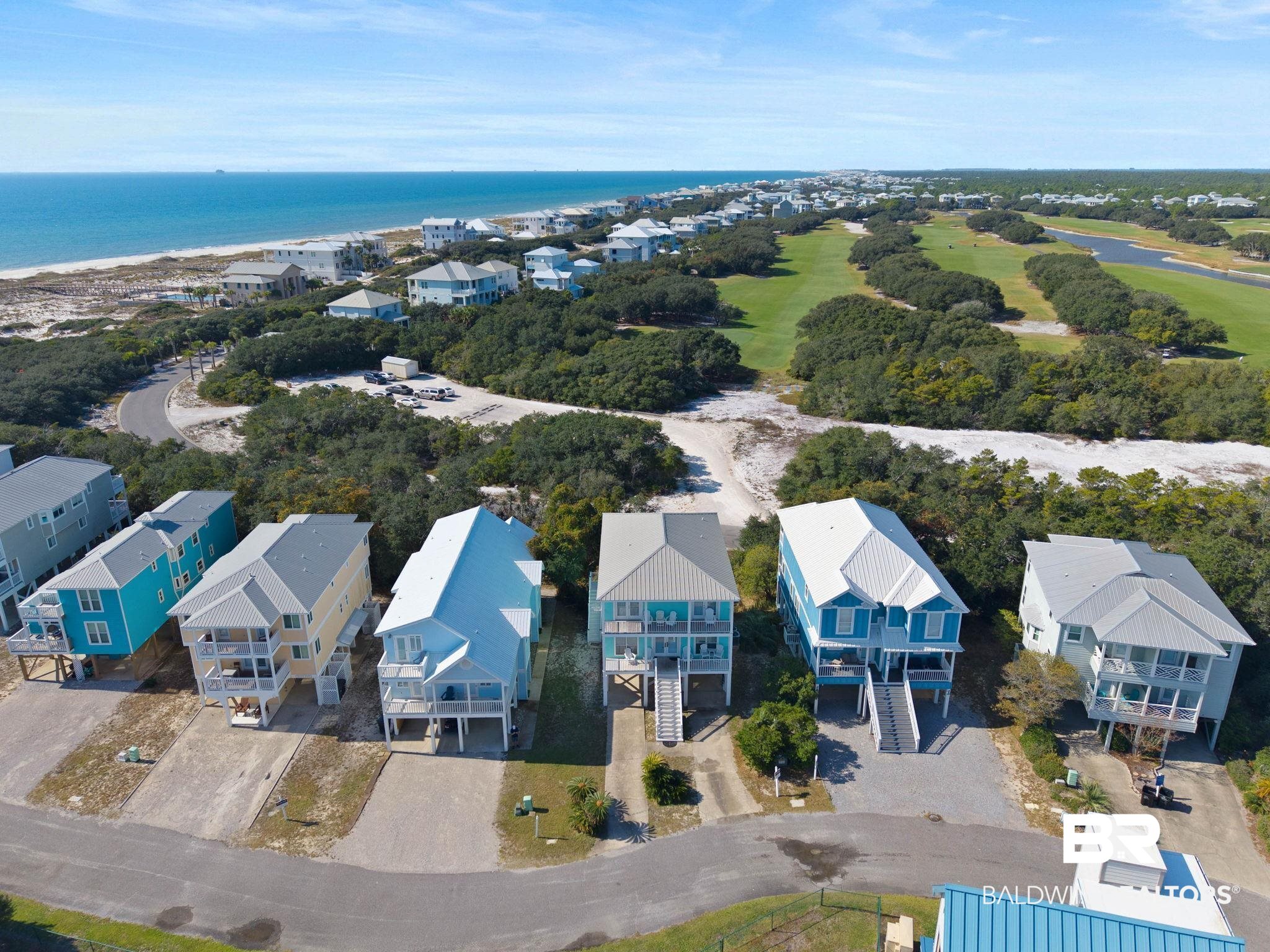 545 Plantation Road, Unit 3 Gulf Shores, AL 36542 - Photo 52 of 54 Aerial perspective of suburban area with a nearby body of water