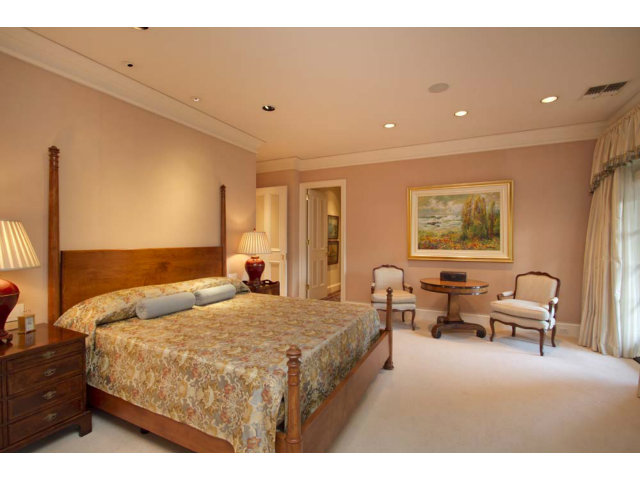 441 Roehampton Road Hillsborough, CA 94010 - Photo 8 of 10 a bedroom with a bed and wooden floor