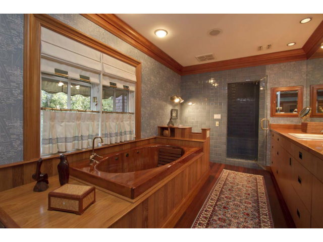 441 Roehampton Road Hillsborough, CA 94010 - Photo 9 of 10 a bathroom with a sink a large mirror and a shower