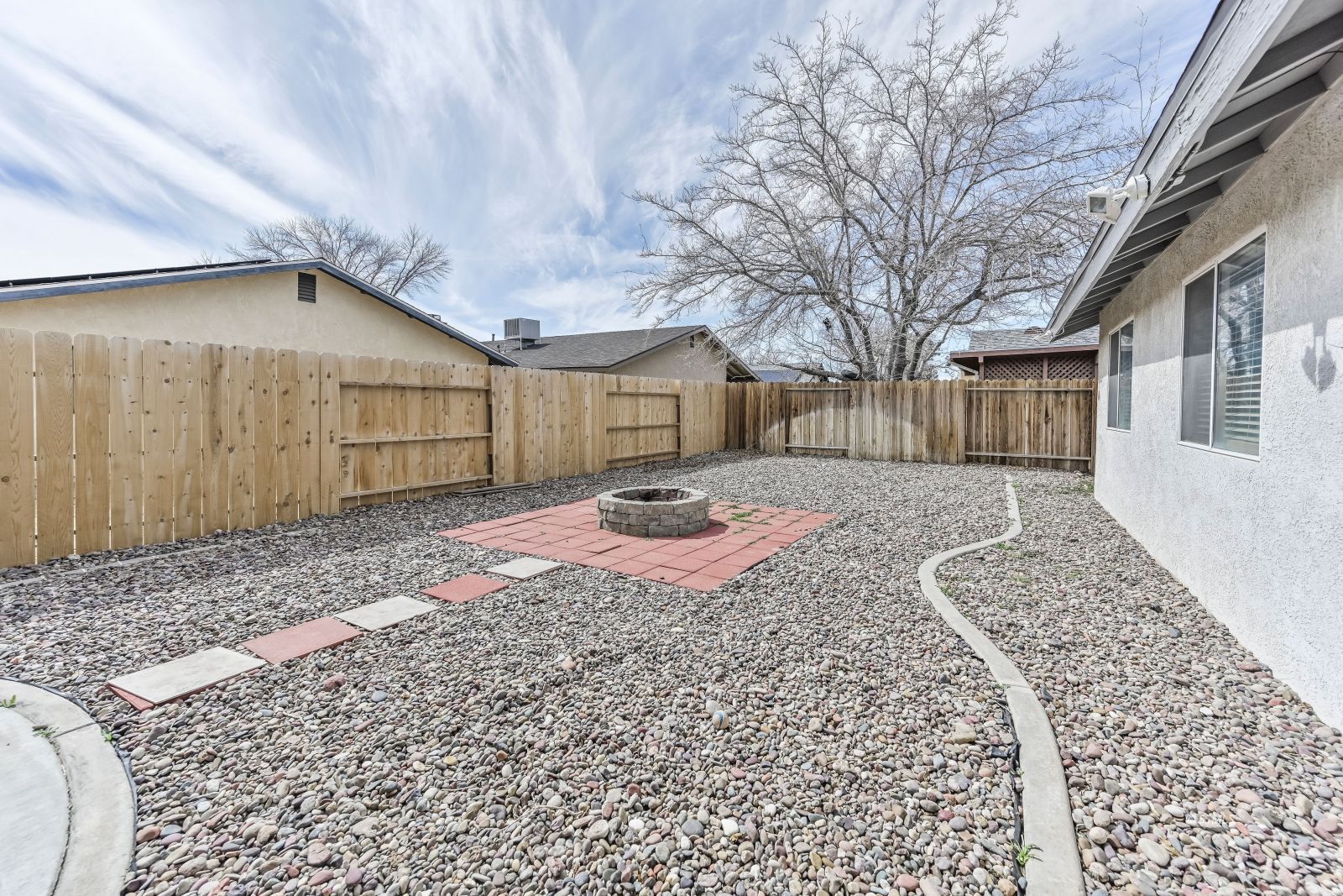 633 East Church Avenue Ridgecrest, CA 93555 - Photo 25 of 27 a front view of a house with a yard and garage
