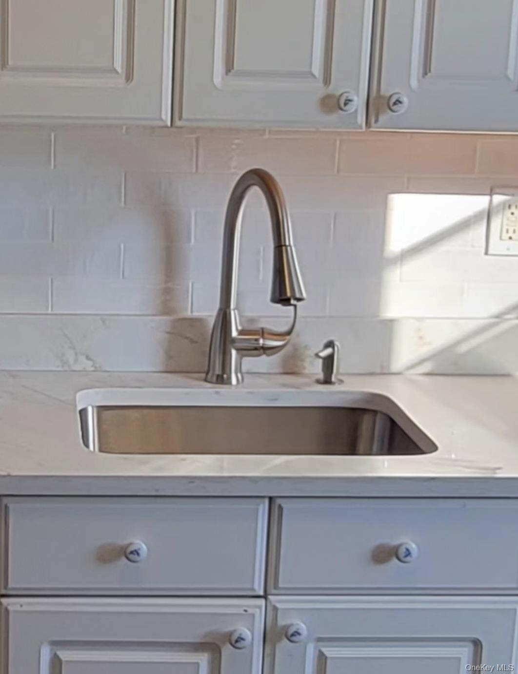 64 Kent Road Island Park, NY 11558 - Photo 2 of 8 a close view of sink and tap