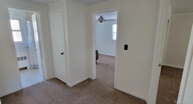 a view of an empty room with a bathroom