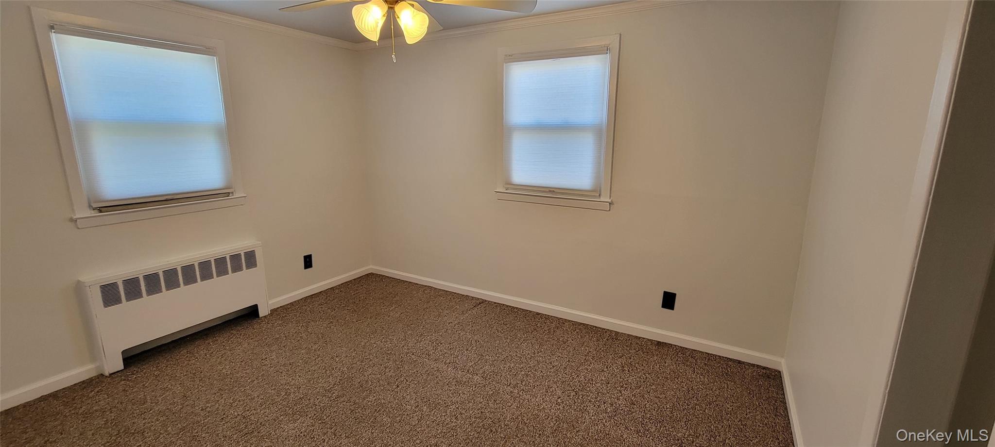 64 Kent Road Island Park, NY 11558 - Photo 7 of 8 an empty room with windows