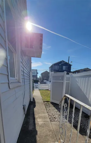 a view of a balcony with wooden floor