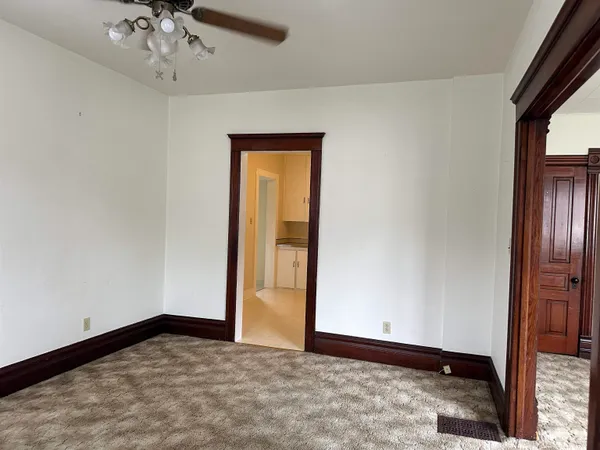 a view of an empty room with a window