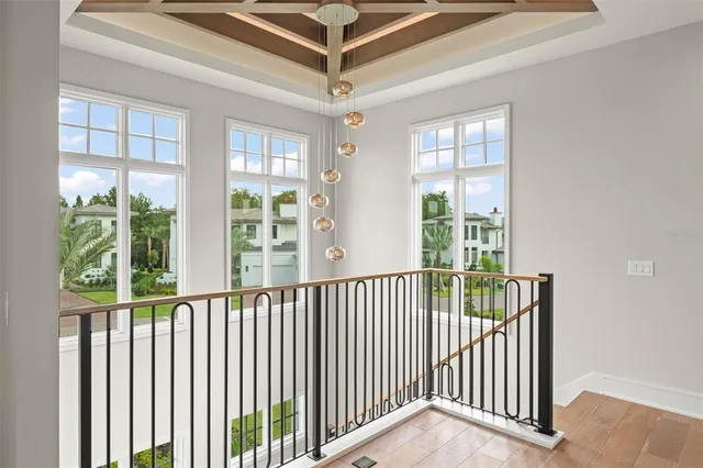 a view of a balcony with wooden floor