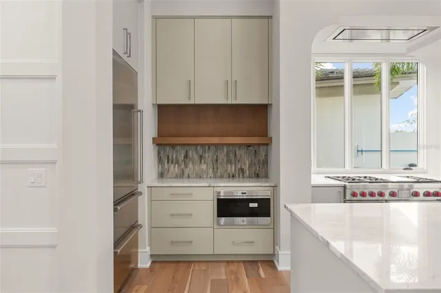a view of kitchen and wooden floor