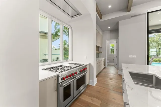 a kitchen with stainless steel appliances granite countertop a stove and a sink