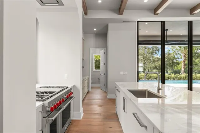 a kitchen with a stove and a sink