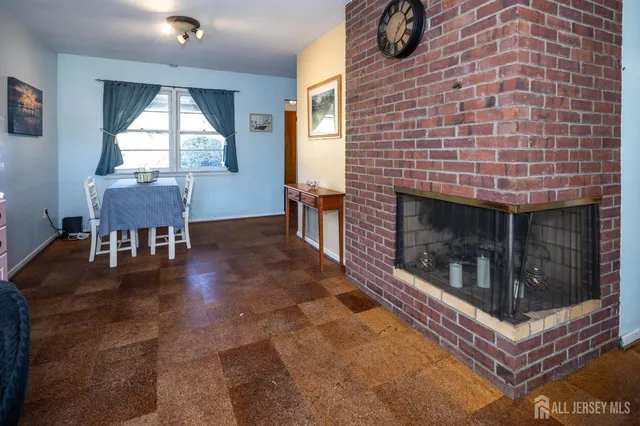 a living room with furniture a window and a fireplace