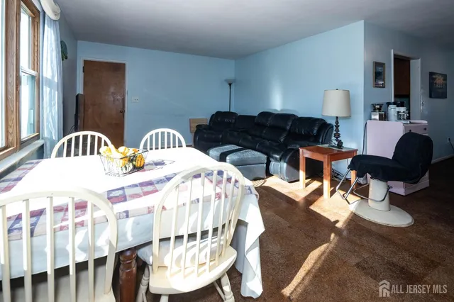 a bed room with two beds and a chair