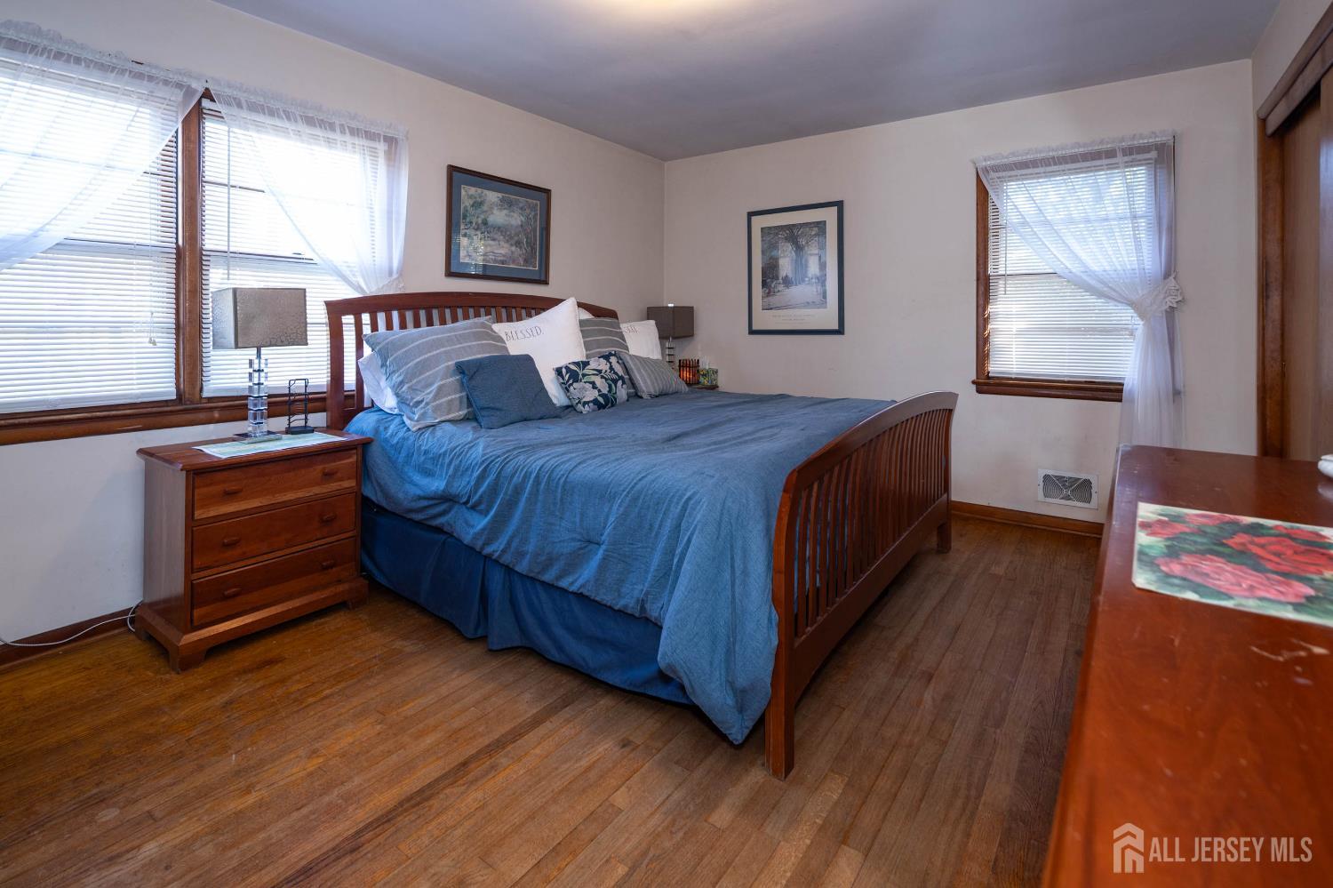 900 River Road Piscataway, NJ 08854 - Photo 18 of 37 a bedroom with a bed and a dresser next to a window
