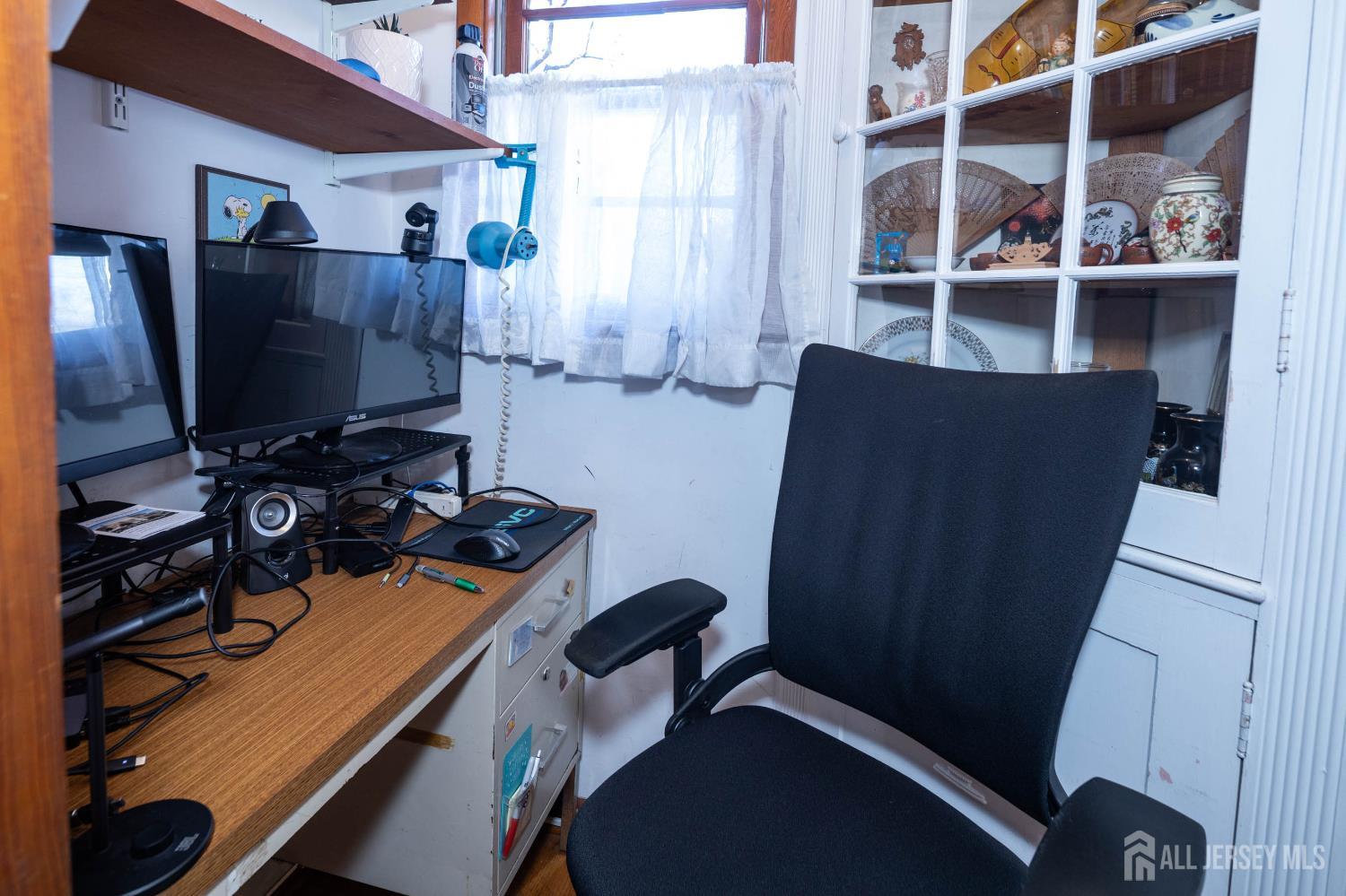900 River Road Piscataway, NJ 08854 - Photo 19 of 37 a view of workspace with wooden floor shelves