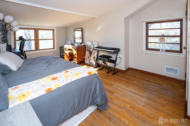 a bed room with furniture and a window