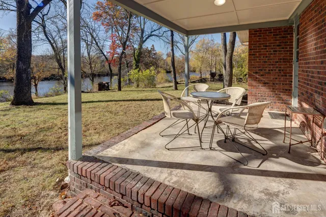 a view of a patio with a yard