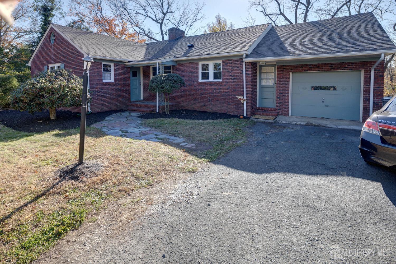 900 River Road Piscataway, NJ 08854 - Photo 5 of 37 a front view of a house with a yard