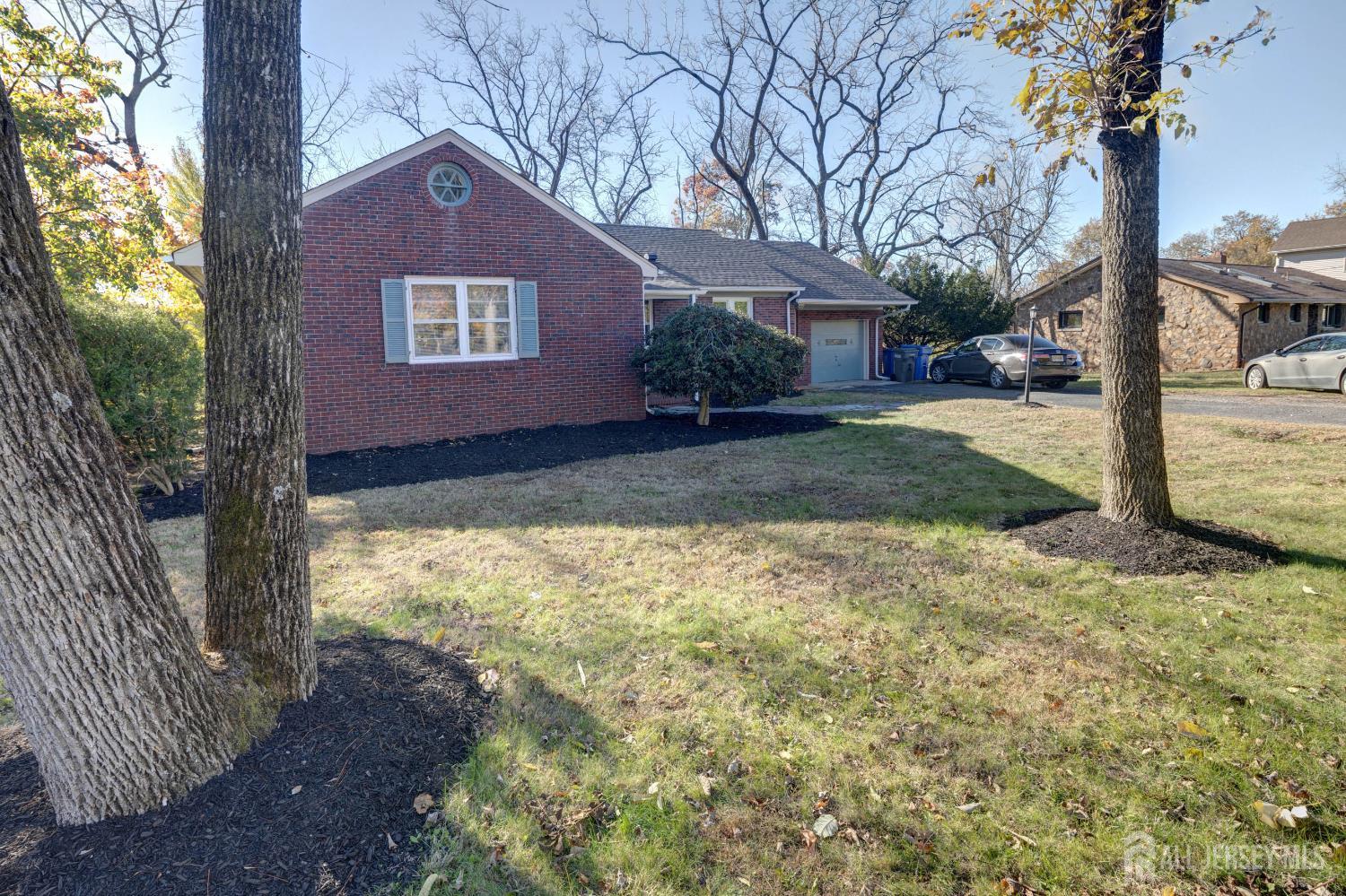 900 River Road Piscataway, NJ 08854 - Photo 6 of 37 a front view of a house with garden