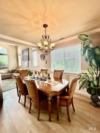 a view of a dining room and livingroom with furniture
