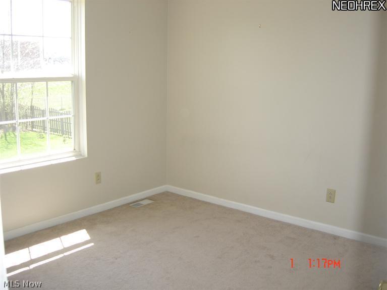 7525 Reynolds Road Mentor, OH 44060 - Photo 12 of 23 Bedroom 2 overlooks backyard.